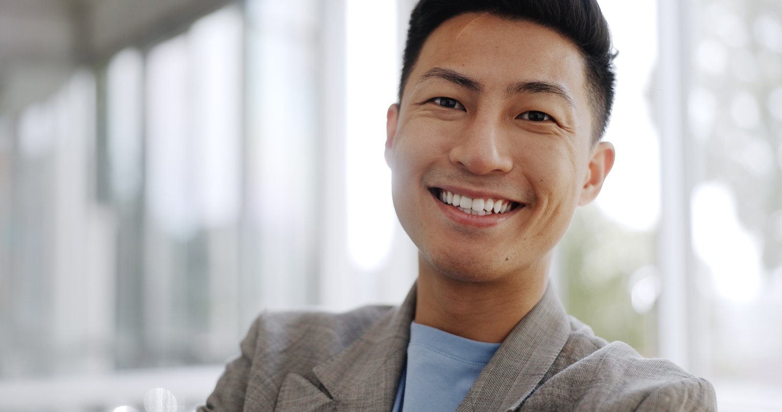 Singapore, leadership or portrait of a businessman with a smile in office of a startup company. Hap
