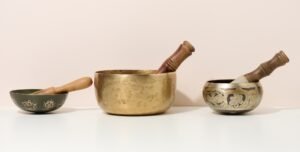 Singing bowls on a white table. Religious items for meditation